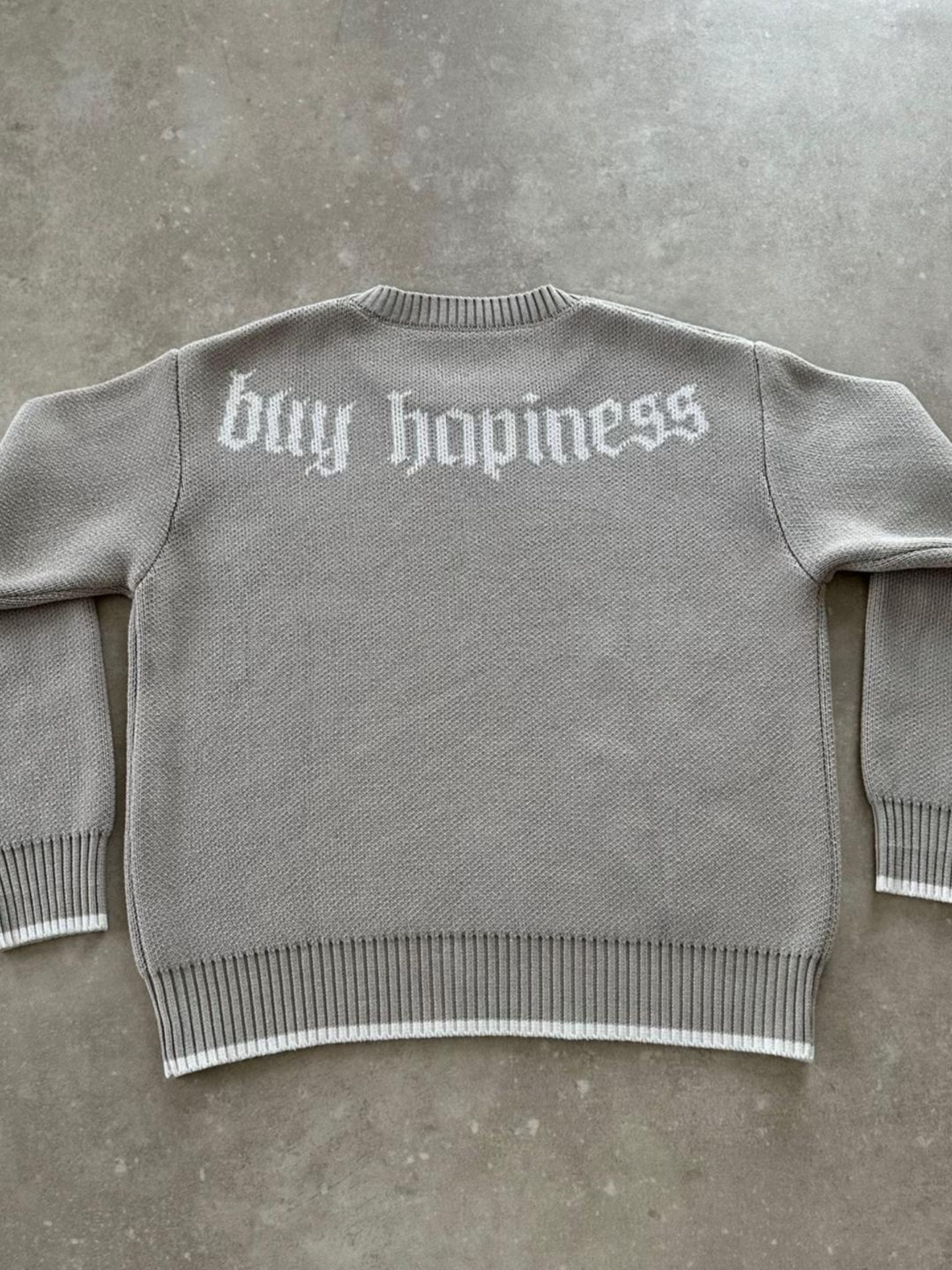 "BUY HAPPINESS" KNIT SWEATER